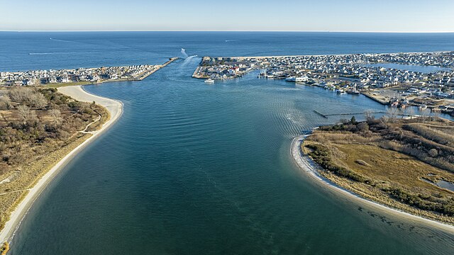 Aerial view of the Manasquan Inlet connecting the Atlantic Ocean and the Manasquan River, a prime Jersey Shore real estate location near Manasquan and Point Pleasant Beach, NJ.