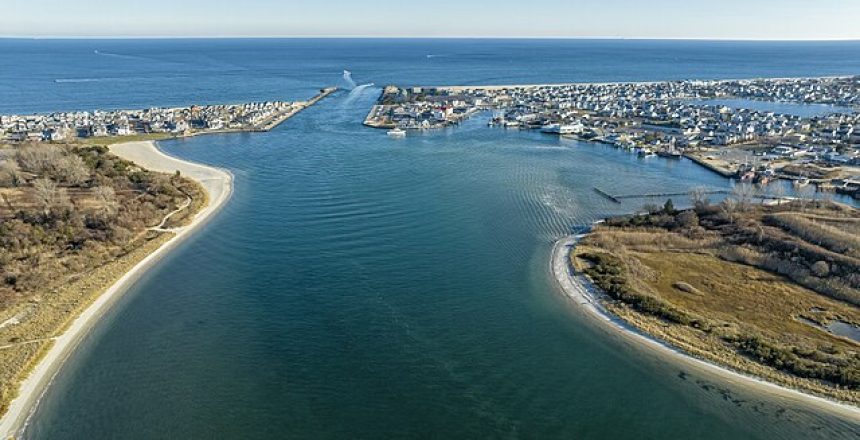 Aerial view of the Manasquan Inlet connecting the Atlantic Ocean and the Manasquan River, a prime Jersey Shore real estate location near Manasquan and Point Pleasant Beach, NJ.