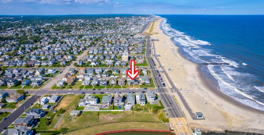 Aerial view of lagoon-front homes in Point Pleasant Beach, NJ, featuring private boat docks and luxury waterfront real estate near the Barnegat Peninsula.